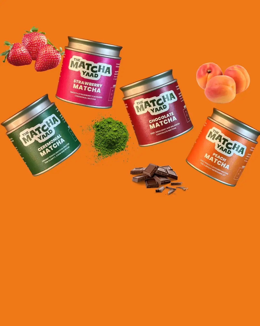 Four cylindrical metal containers of the matcha yaad matcha powder in different flavors, each with a distinct colored label and topped with silver lids.