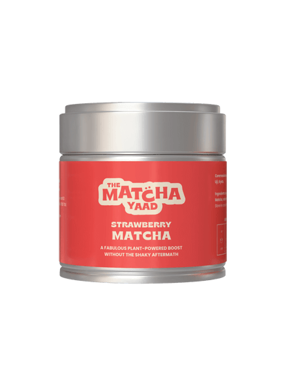 Strawberry Matcha powder in a red-labeled tin from The Matcha Yaad, ideal for iced lattes and smoothies. A plant-powered tea blend for an energy boost.