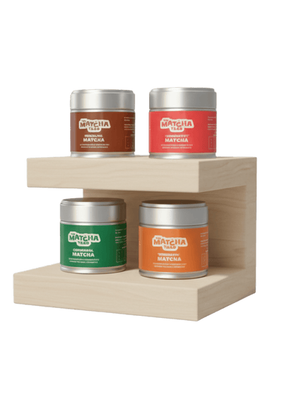 The Complete Matcha Collection featuring four flavoured matcha tea tins on a wooden display shelf, ideal for tea lovers and energy drink enthusiasts.