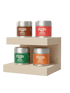 The Complete Matcha Collection featuring four flavoured matcha tea tins on a wooden display shelf, ideal for tea lovers and energy drink enthusiasts.